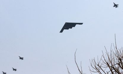 A U.S. Air Force B-2 stealth bomber flies over the Osan U.S. Air Base in Pyeongtaek, south of Seoul, South Korea on March 28.