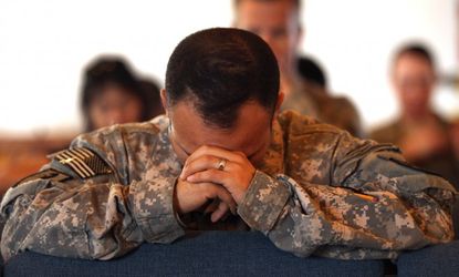 U.S. Army soldiers pray