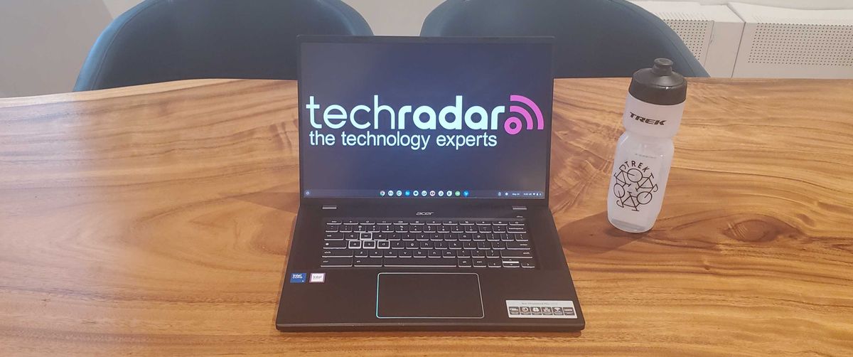 black chromebook on wooden desk