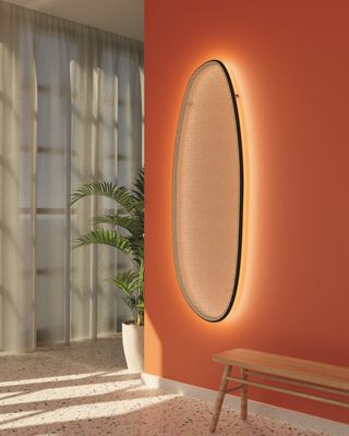 A living room with a backlit wall panel