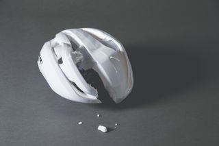 A cycling helmet that has been damaged following a cycling crash