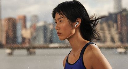 Woman running and wearing Apple AirPods 