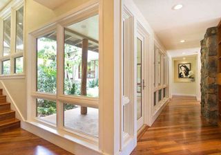 wooden flooring with white ceiling and glass window
