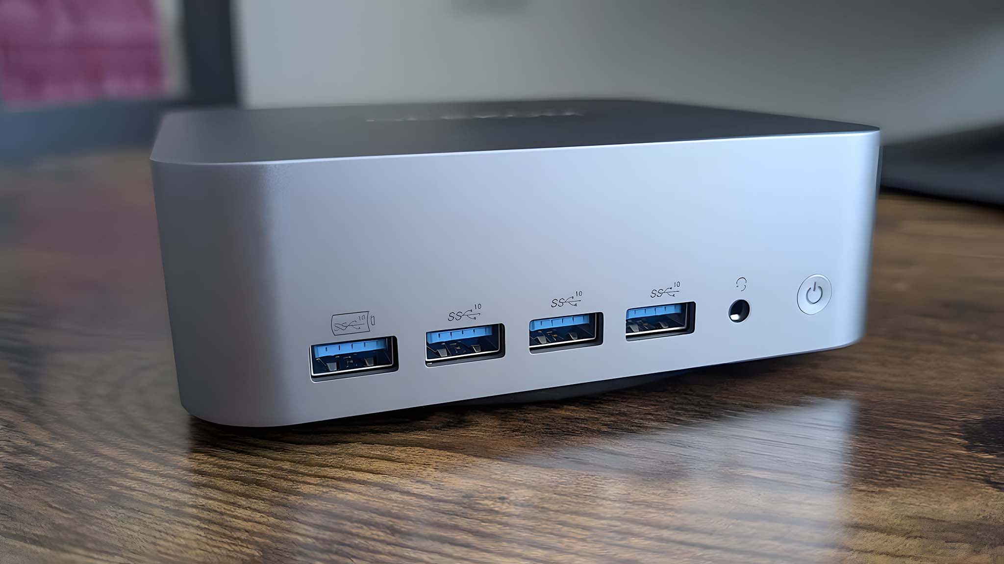 Closeup of Geekom GT1 Mega's front ports including four USB-A ports and a headphone jack.