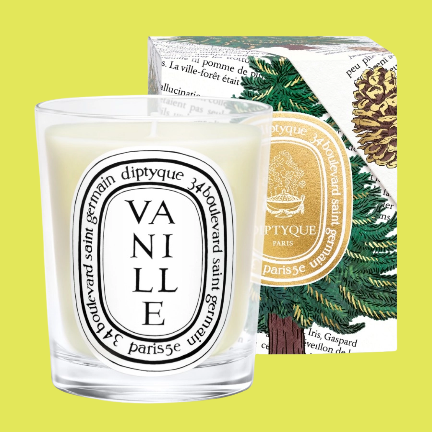 A glass candle beside a Christmas-themed box