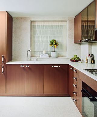 kitchen with liquid metal finish cabinets and faux shagreen drawers