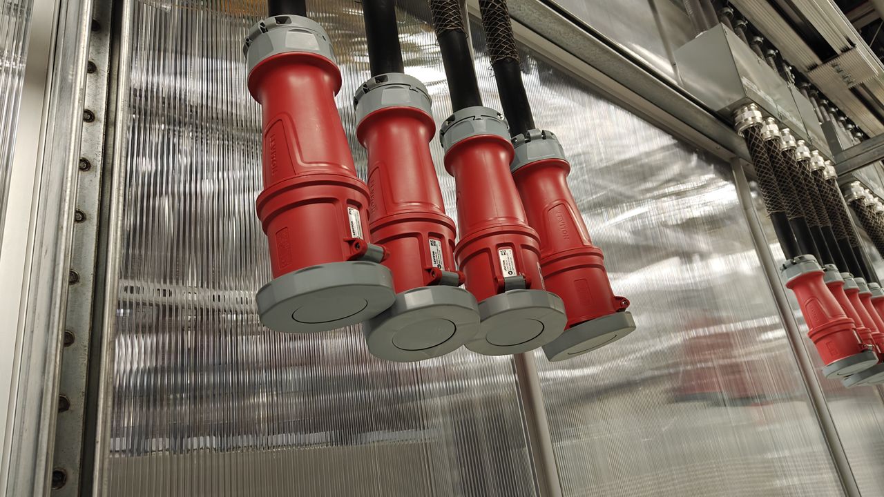 NVL72 800VDC power plugs hanging in the SuperLab room