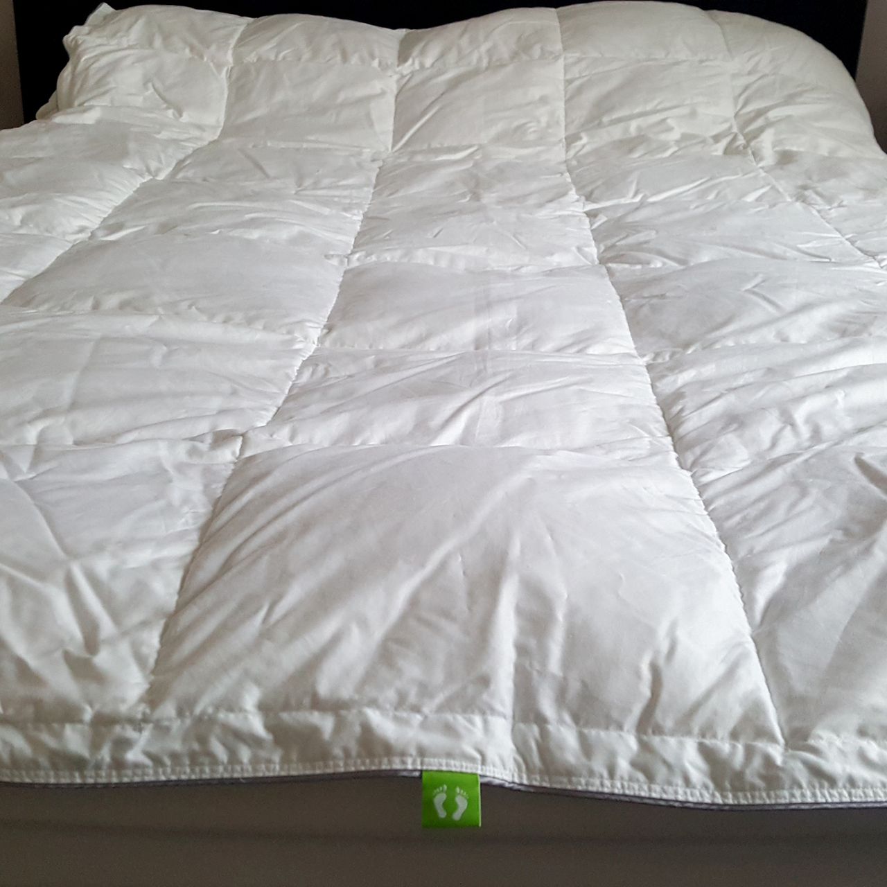 The scooms All-Season Hungarian Goose Down Duvet on a bed being tested