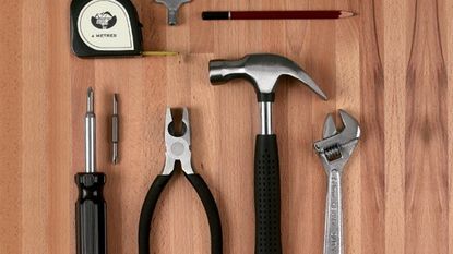 home tool kit screwdriver hammer measure tape spanner