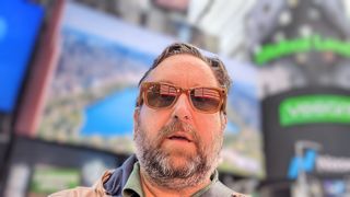 Ray-Ban Meta smart glasses reflecting Times Square on author's face