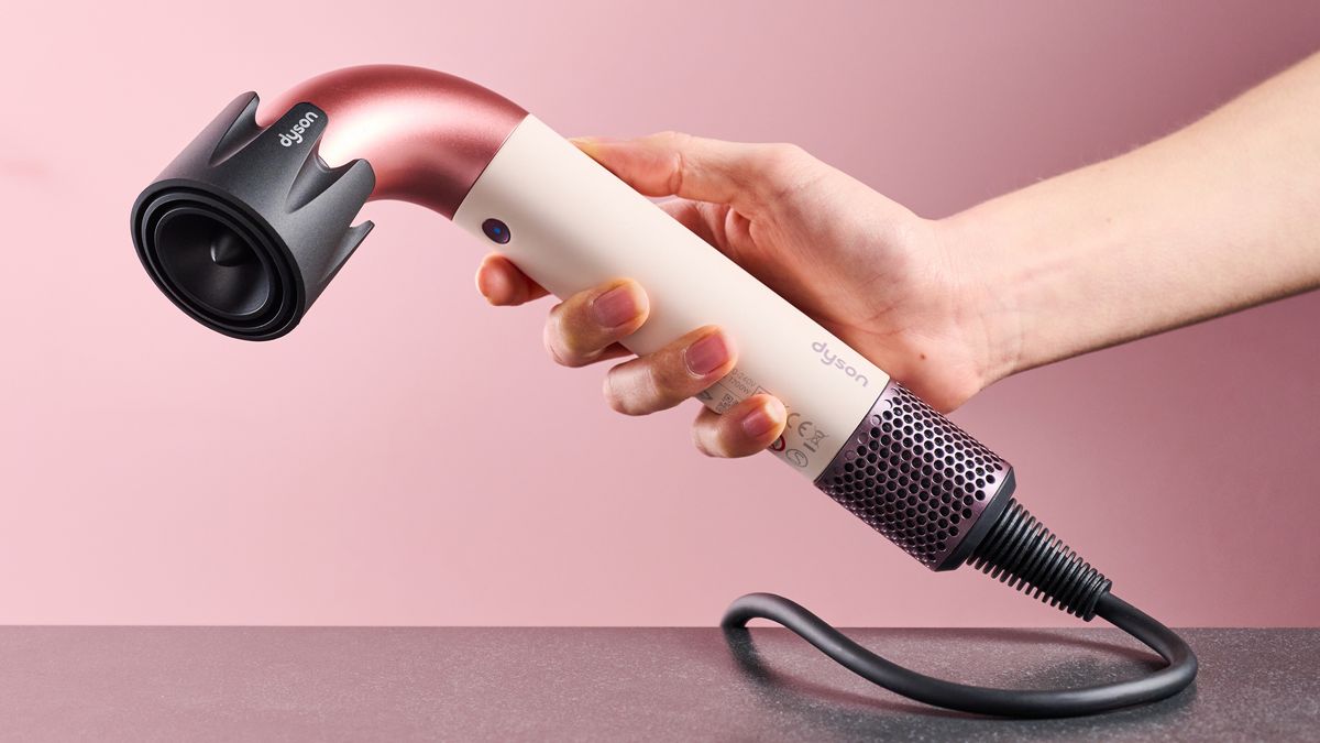 Dyson Supersonic r hair dryer in reviewer's hand