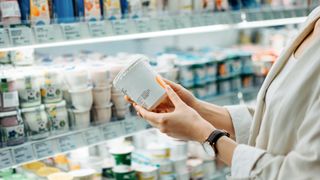 woman checking a food label