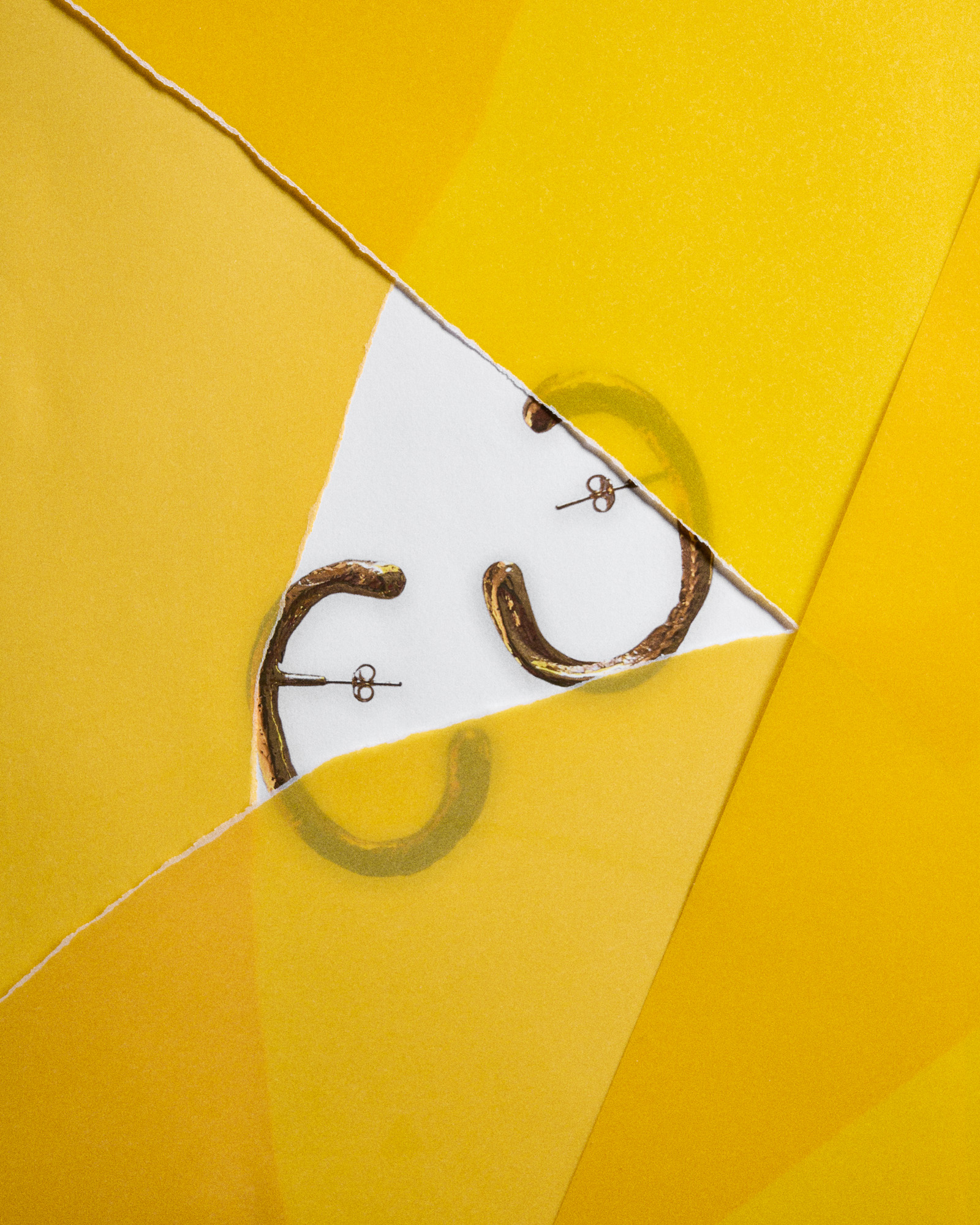 earrings against yellow background