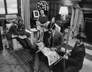 The Royal Family relaxing in a drawing room at Sandringham House, Norfolk (clockwise) Prince Edward, Prince Philip, Duke of Edinburgh, Queen Elizabeth II, Princess Anne, Charles, Prince of Wales and Prince Andrew