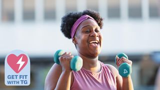 a photo of a woman holding dumbbells