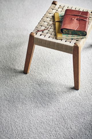 light colored loop pile carpet in light finish made from wool