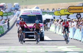 Caleb Ewan and his teammates finish stage 14 of the Tour de France just ahead of the broom wagon