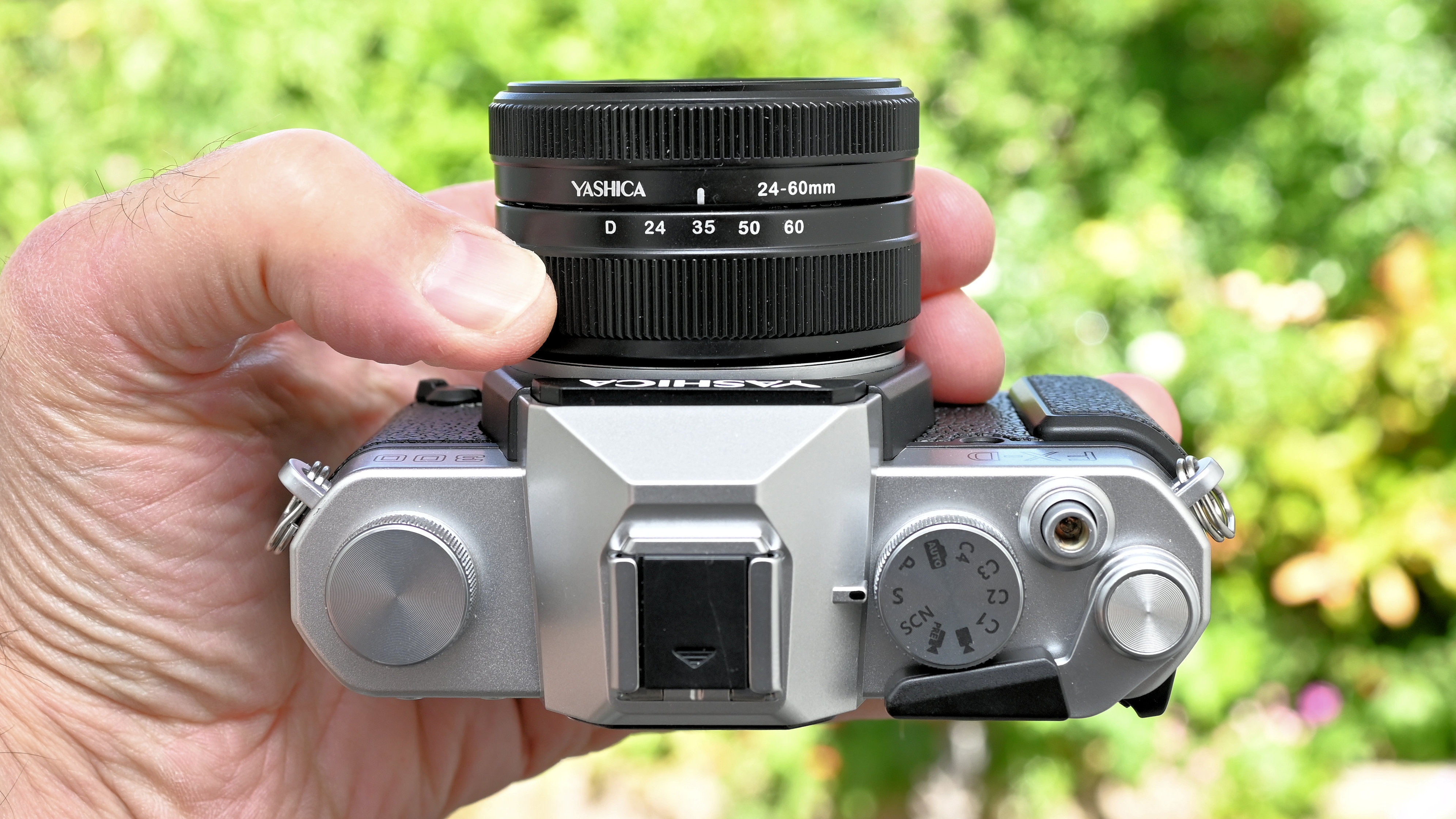 Yashica FX-D 300 product shot, camera held in hand