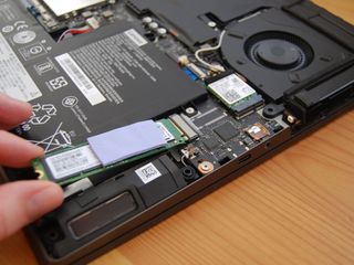 Slide the SSD out of the slot