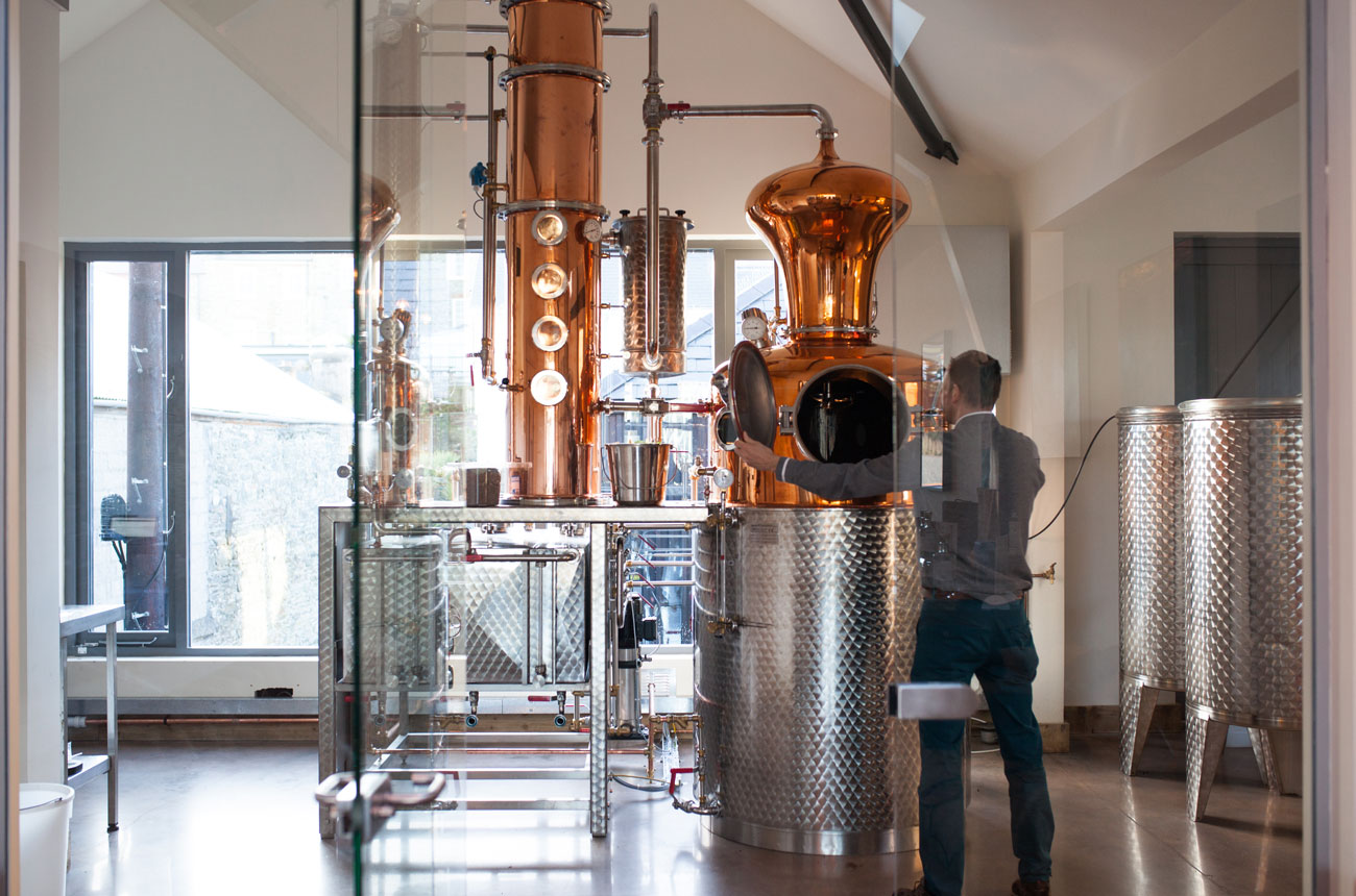 A copper still inside a distillery