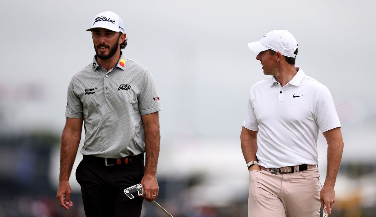 Homa and McIlroy walk the fairway