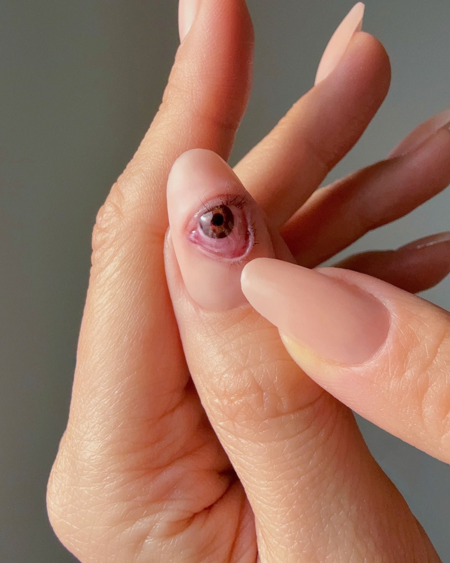 realistic eye nail art on thumbnail