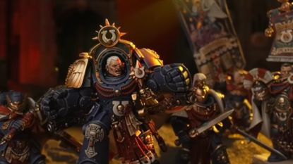 New Marneus Calgar miniature amongst Ultramarines models on a shadowed battlefield