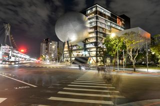 dramatic night time shot of Taipei performing art centre by OMA
