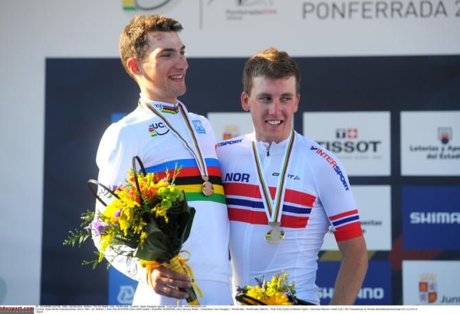 World champion Sven Erik Bystrom celebrates with teammate Kristoffer Skjerping who won bronze