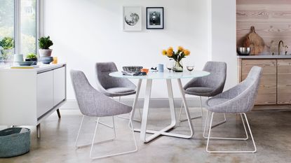 grey fabric chair and white table dining set by furniture village
