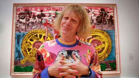 Grayson Perry poses during a photo call for his Smash Hits exhibition being held in Royal Scottish Academy
