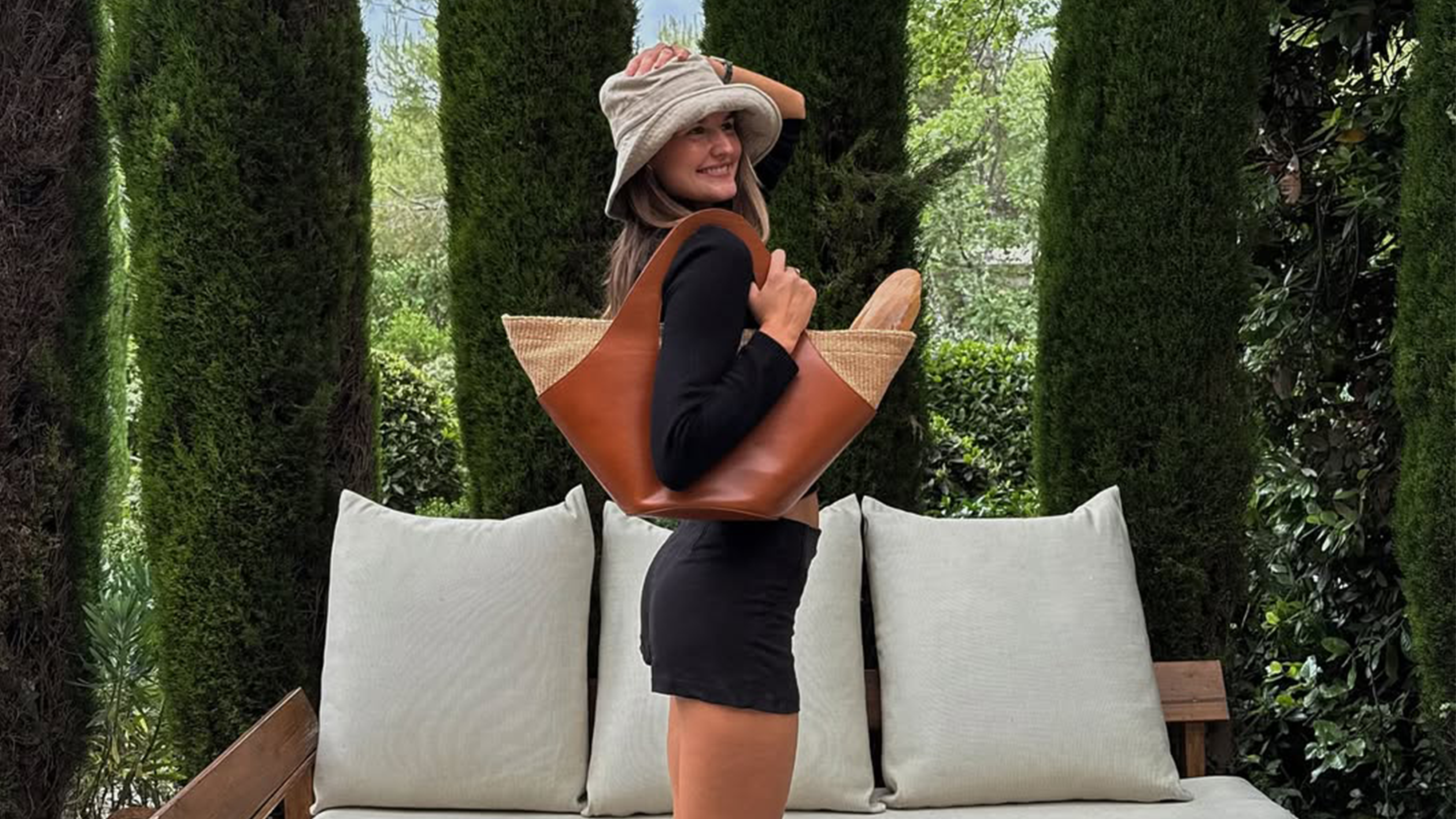 Sara Walker wearing micro shorts with mid-calf boots