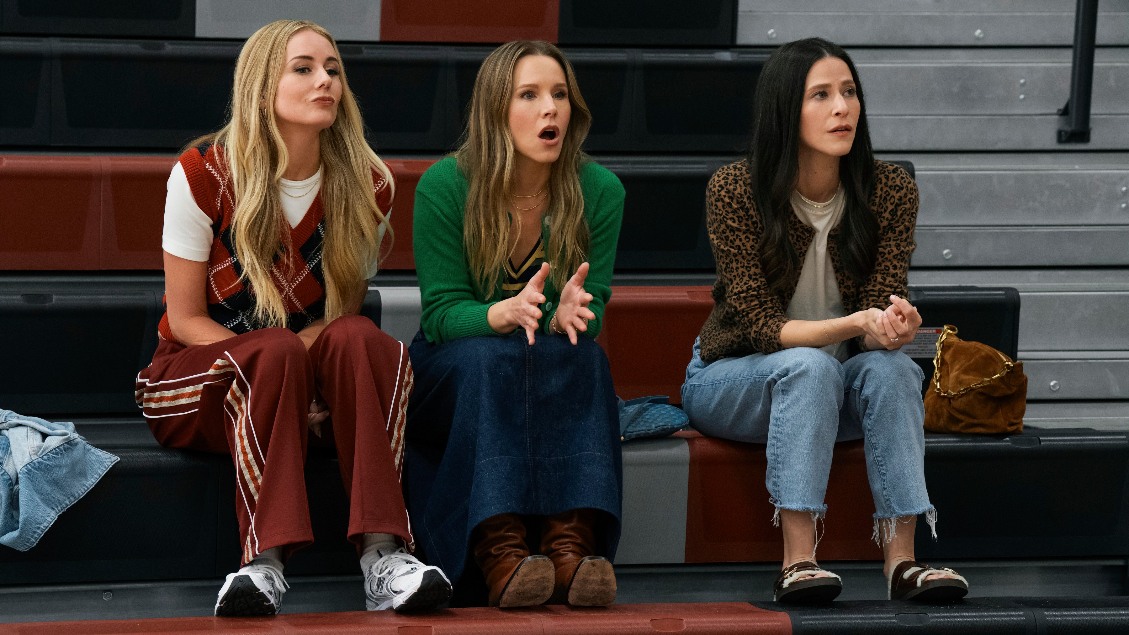 L-R: Morgan (Justine Lupe), Joanne (Kristen Bell) and Esther (Jackie Tohn) sit next to one another in a scene from "Nobody Wants This" season 2