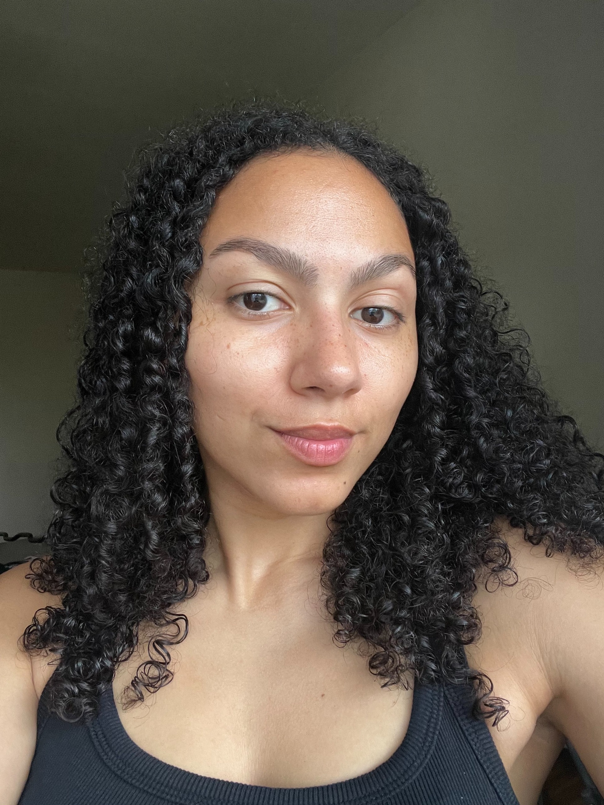 Assistant beauty editor Sabrina Talbert testing the As I Am Curl Color in Bold Gold.
