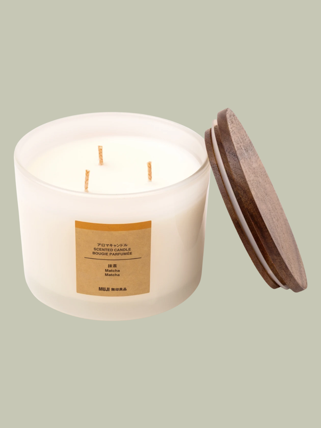 A three wick glass matcha candle from MUJI
