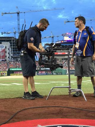 A MOVI operator (left) and utility manage camera movements on the field.