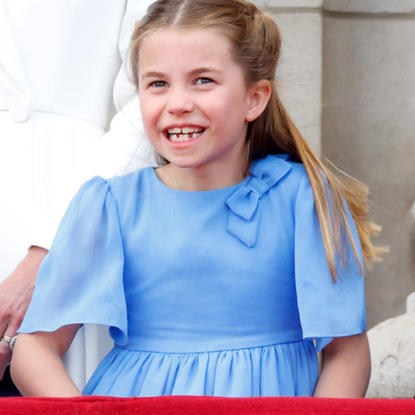 Princess Charlotte of Cambridge watches a flypast from the balcony of Buckingham Palace during Trooping the Colour on June 2, 2022 in London, England. Trooping The Colour