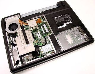 The cooling apparatus dominates the upper left side of the m5550 and covers both the CPU and graphics processor. In the middle center is memory, with the wireless card in the middle bottom. At the bottom right is the unit's hard drive.