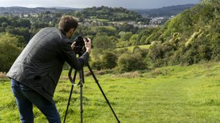 Image shows photographer using the Manfrotto 190 Go! tripod.