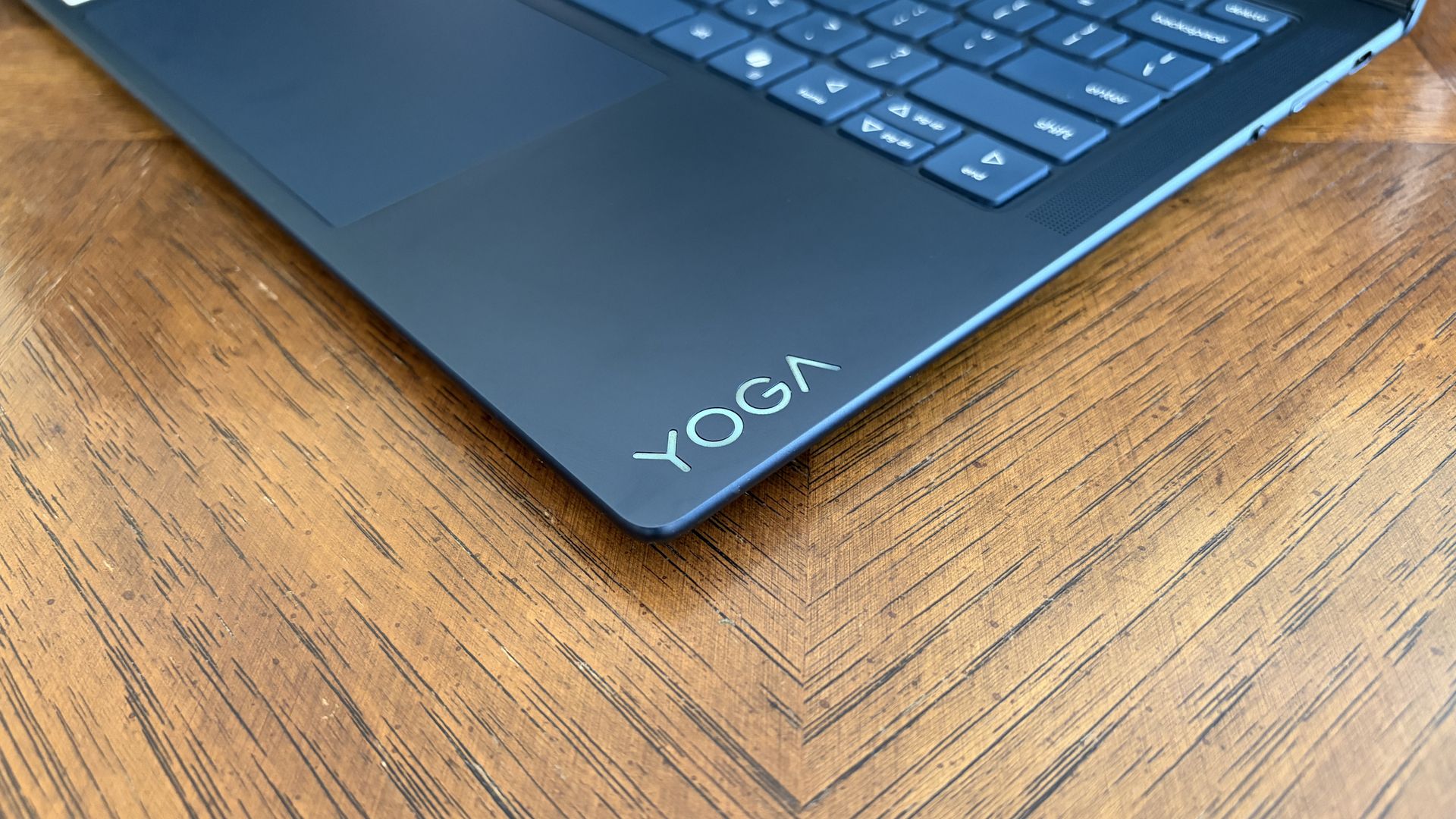A sleek black laptop with the word 