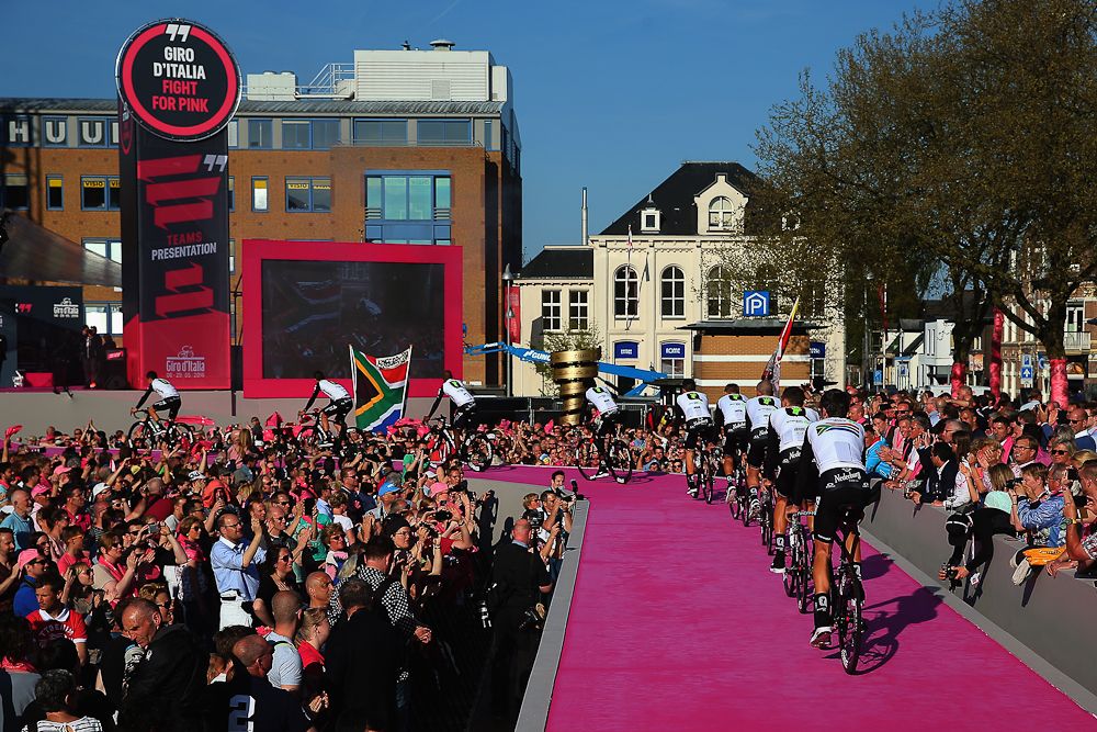 Dimension Data ride on stage at the Giro team presentation.