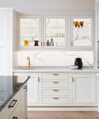 White kitchen with display cabinets and LED lighting