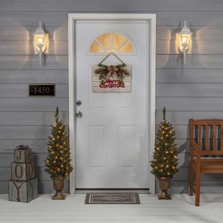 Wayfair duo of Christmas trees by door