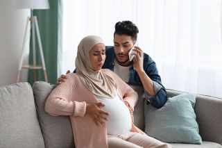 Worried Husband Calling Emergency While His Pregnant Wife Having Contractions