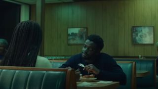 Daniel Kaluuya talking in a diner in Queen & Slim