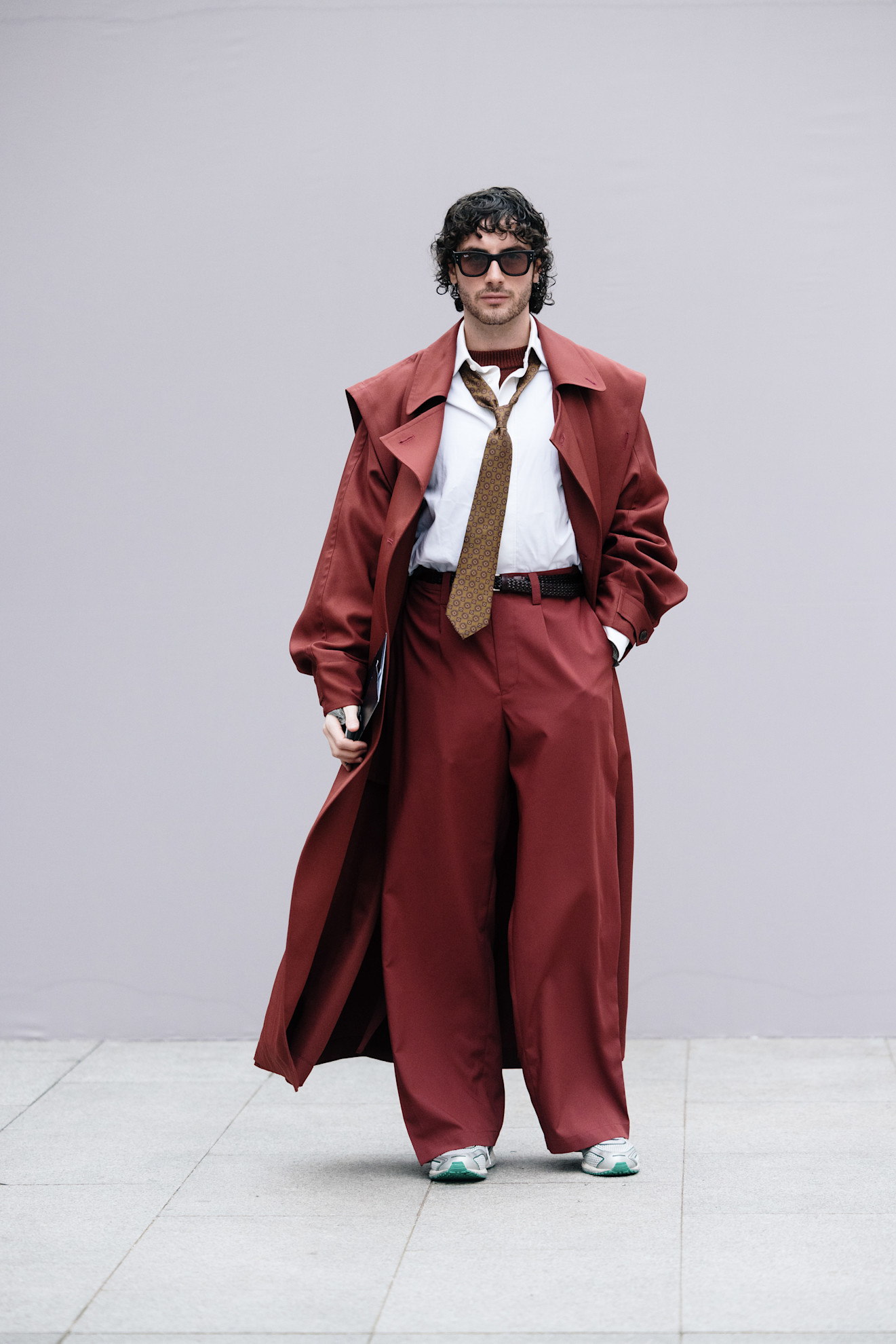 a man wearing a tie in mens fashion week street style