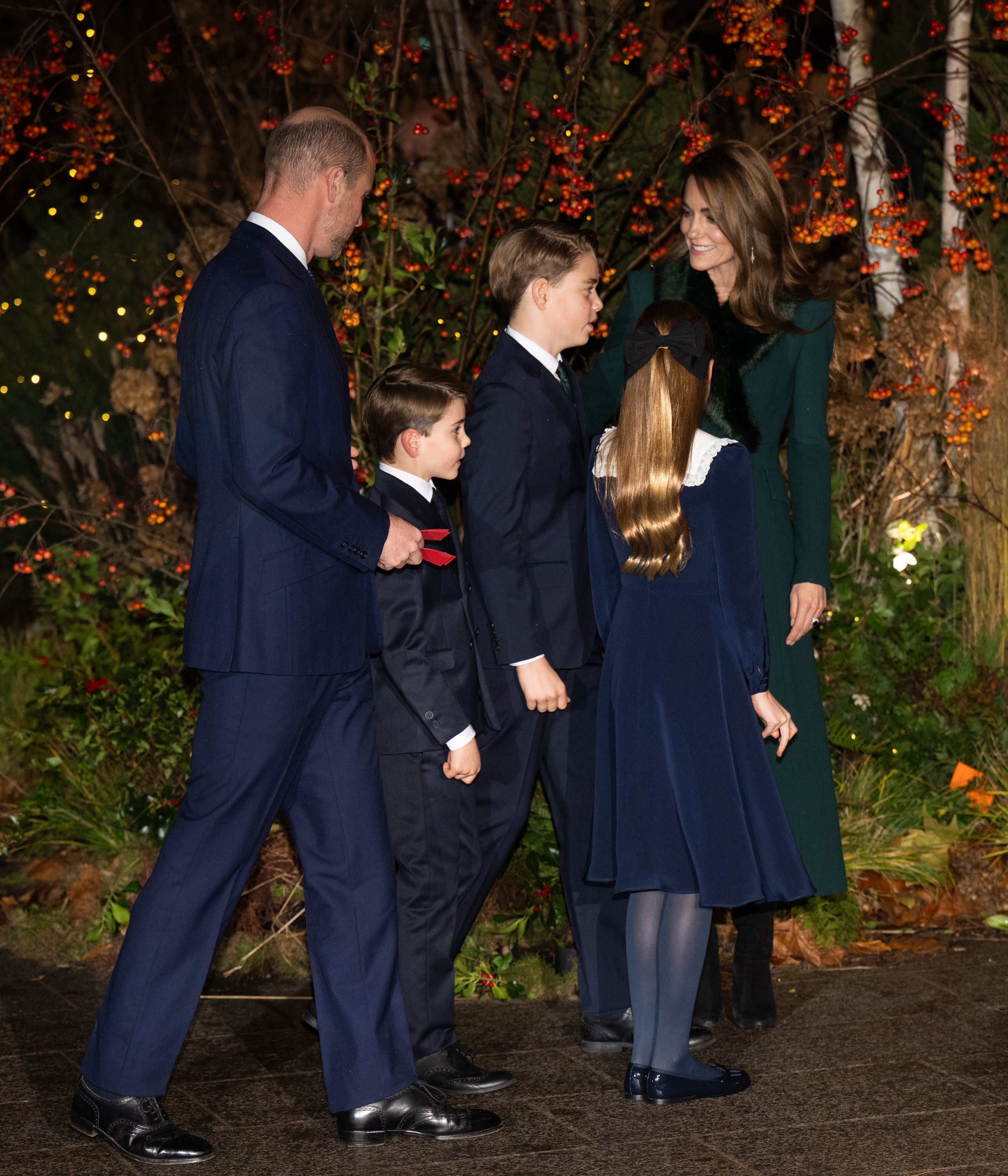 Prince William, Princess Kate, Prince George, Prince Louis and Princess Charlotte standing outside Westminster Abbey at the Together at Christmas concert