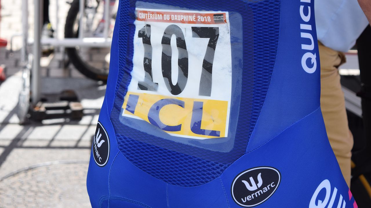 Many brands now produce pockets specifically for race numbers to save using safety pins to affix the numbers