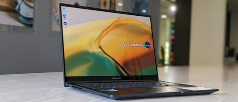 The Asus Zenbook 14 Flip OLED on a white surface