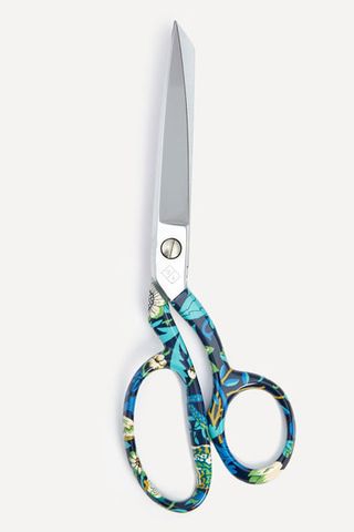 a pair of scissors with a patterned handle